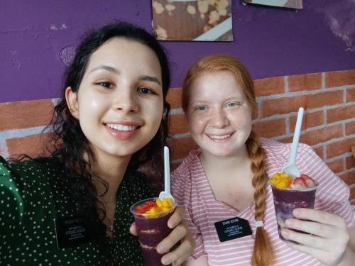 Sisters Grace and Perri enjoy an acai fruit cup