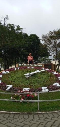 Alyssa by a large, flower clock in Garanhuns