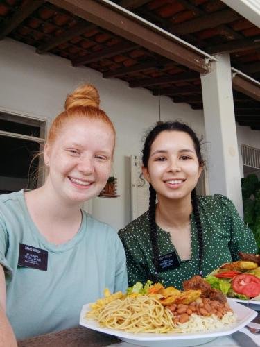 Alyssa and Sister Perri with big plates of food