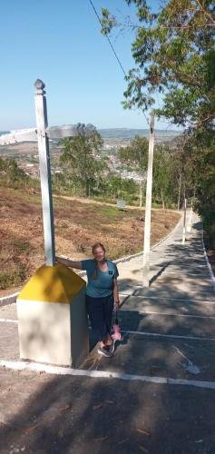 Alyssa on the street/trail leading to the Igreja De Santa Terezinha