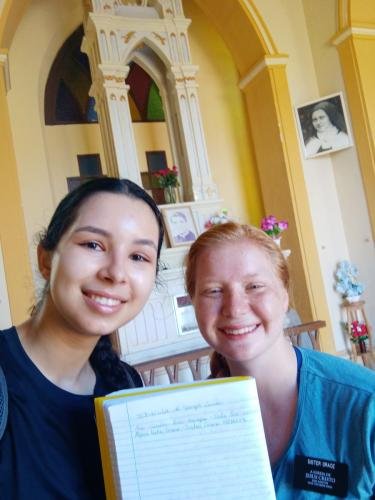 Alyssa and Sister Perri with the guest book in the cathedral on the hill