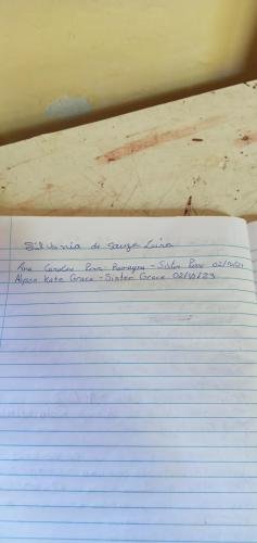 Alyssa and Sister Perri's names on the guest book at the cathedral on the hill