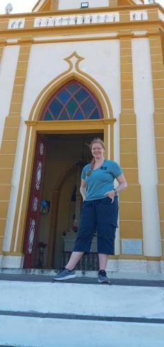 Alyssa at the entrance of the Cathedral on the hill