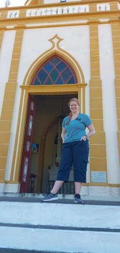 Alyssa at the entrance of the Cathedral on the hill