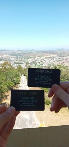 Alyssa and Sister Perri with their name tags on top of the Chapel on the hill