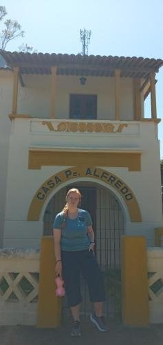 Alyssa in front of Casa Pe. Alredo in Bom Conselho
