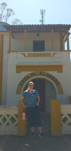 Alyssa in front of Casa Pe. Alredo in Bom Conselho