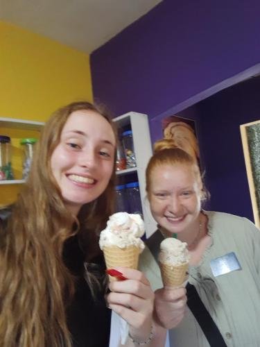 Alyssa and Sister Fuller in a restaurant with big ice cream cones