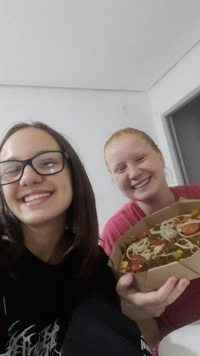Alyssa and Sister Leopoldes with a pizza