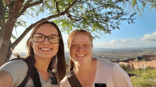 Alyssa and Sister Leopoldes on a hill above Bom Conselho