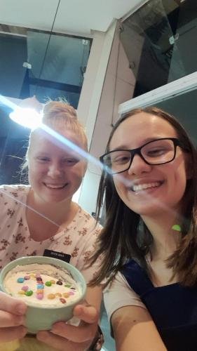 Alyssa and Sister Leopoldes in a restaurant with a bowl of food