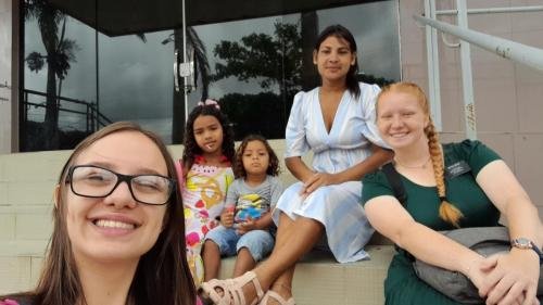 Alyssa and Sister Leopoldes on the stairs with some members