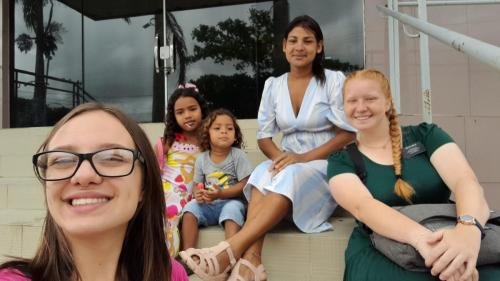 Alyssa and Sister Leopoldes on the stairs with some members