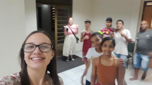 Alyssa and Sister Leopoldes saying goodbye to some Bom Conselho ward members