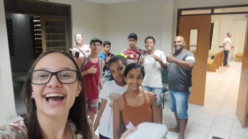 Alyssa and Sister Leopoldes saying goodbye to some Bom Conselho ward members