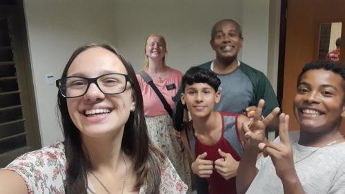 Alyssa and Sister Leopoldes saying goodbye to some Bom Conselho ward members