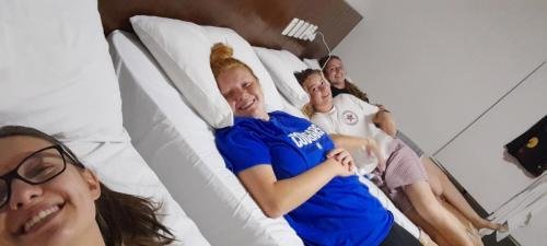 All four sisters in their hotel beds the night before Zone Conference