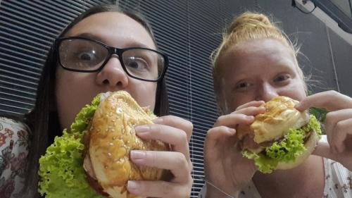 Alyssa and Sister Leopoldes enjoy some hamburgers