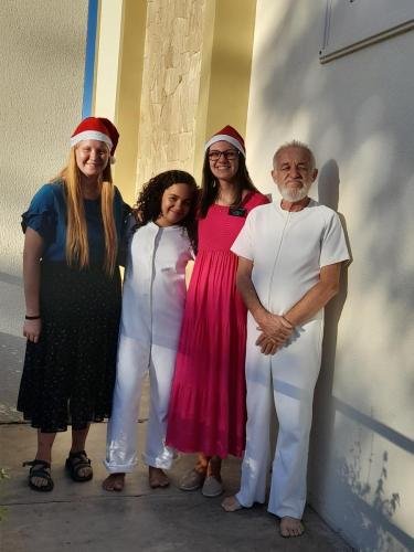 Alyssa and Sister Leopoldes with Laura and Dario on their baptism day