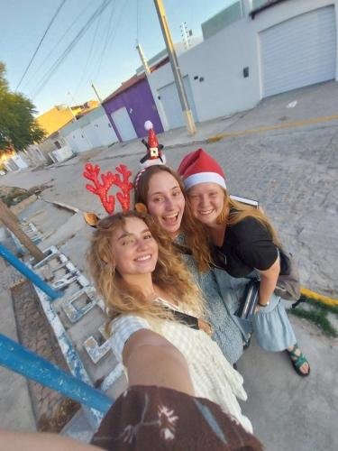 Alyssa with Sisters Fuller and Brewer take a selfie on the street