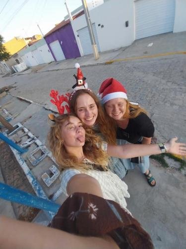 Alyssa with Sisters Fuller and Brewer take a selfie on the street