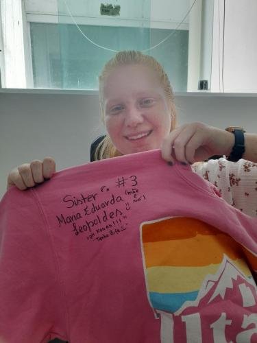 Alyssa with a shirt with writing on it from Sister Leopoldes