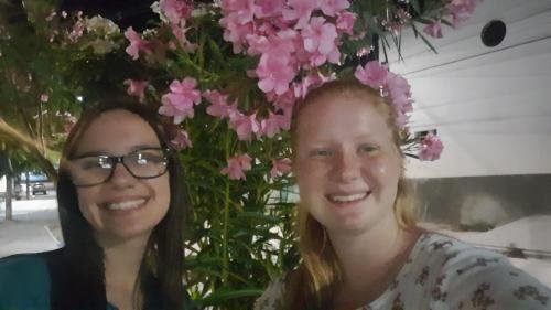 Alyssa and Sister Leopoldes by some pretty flowers