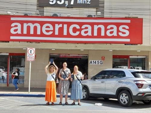 Alyssa with Sisters Fuller and Brewer under an Americanas sign in Arcoverde