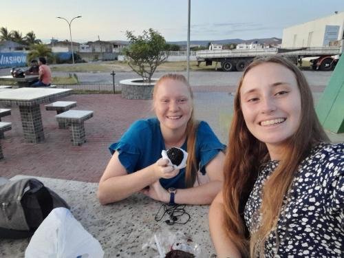 Alyssa and Sister Fuller at the table enjoying some acai