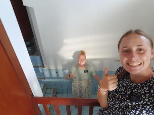 Alyssa and Sister Fuller clean the baptismal font before a baptism