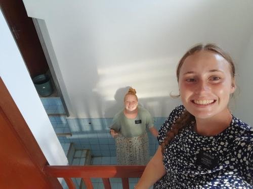 Alyssa and Sister Fuller clean the baptismal font before a baptism