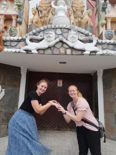 Alyssa and Sister Fuller pose like a statue on the castle in Pesqueira