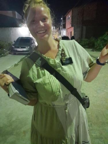 Alyssa with a moth friend on her name tag