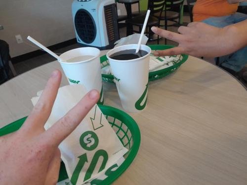 Alyssa and Sister Zurita giving peace signs at Subway