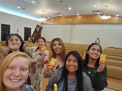 Alyssa and the sisters from her zone in the chapel with treats