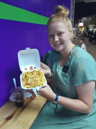 Alyssa with fries to celebrate 8 months in the field