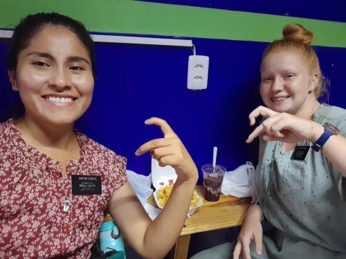 Alyssa and Sister Zurita enjoy some fries for Alyssa's 8 month mark