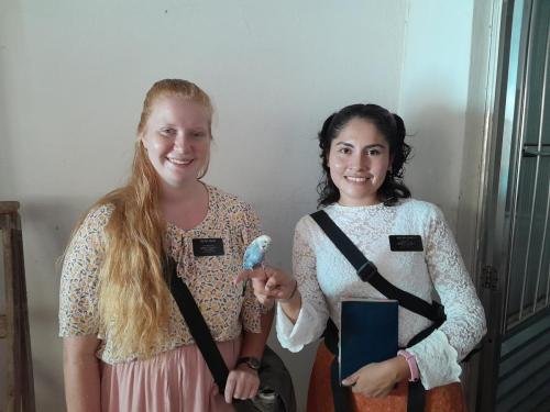 Alyssa and Sister Zurita with a little parakeet