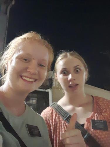 Alyssa and Sister Tadje outside giveing a thumbs up selfie