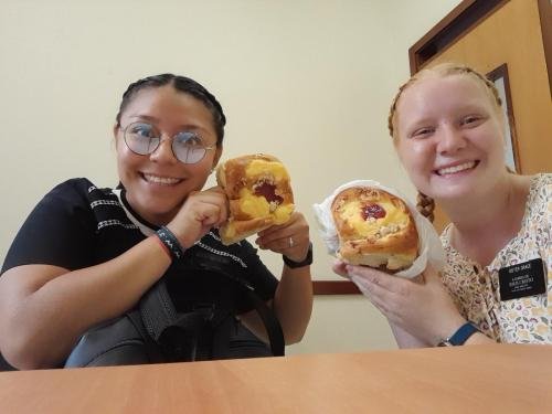 Alyssa and Sister Villator enjoy a cinnamon roll