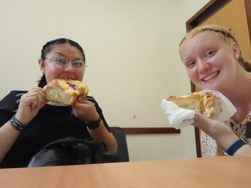 Alyssa and Sister Villator enjoy a cinnamon roll
