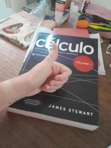 Alyssa gives a big thumbs up on a calculus book she was given