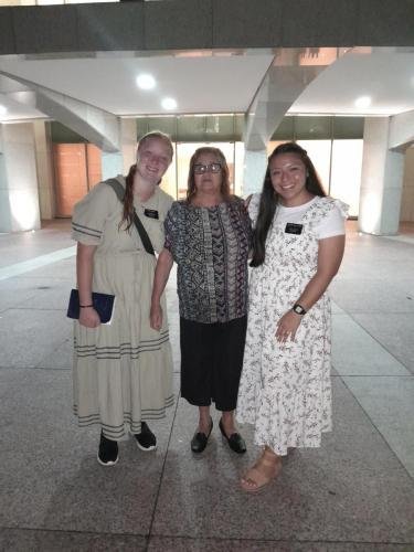 Alyssa and Sister Villatoro at the temple with a member