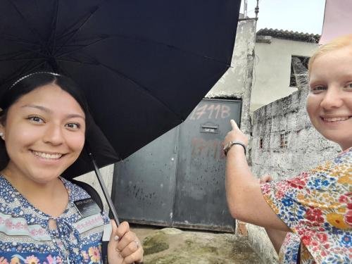 Alyssa and Sister Villatoro in front of a door