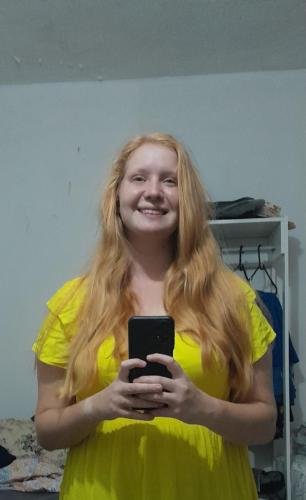 Alyssa shows her really long hair in a mirror selfie