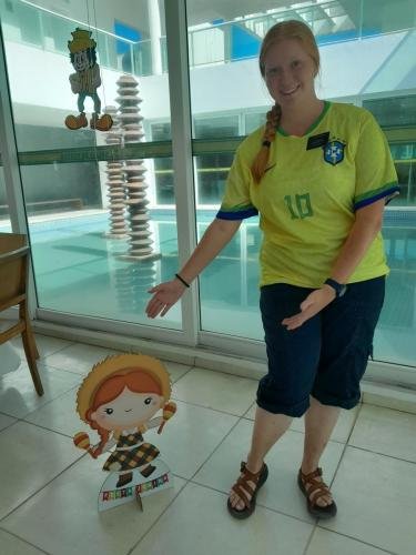 Alyssa with a cutout maraca doll