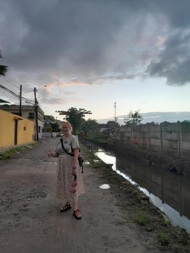 Alyssa with a thumbs up on a dirt road