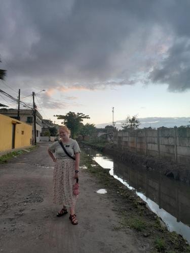 Alyssa standing on the dirt road