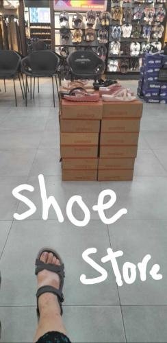 Alyssa tries on shoes at the shoe store