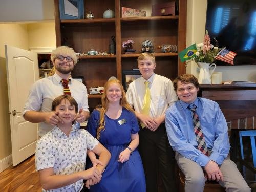 Alyssa with the Phillips brothers during her missionary farewell open house